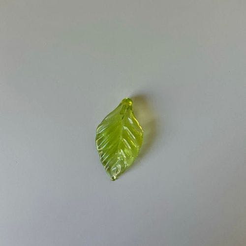 A glass leaf necklace pendant