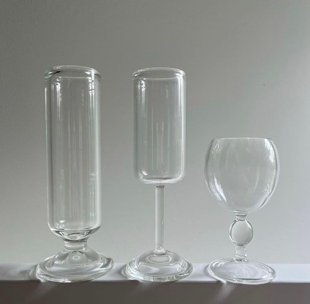 Three glasses on a shelf