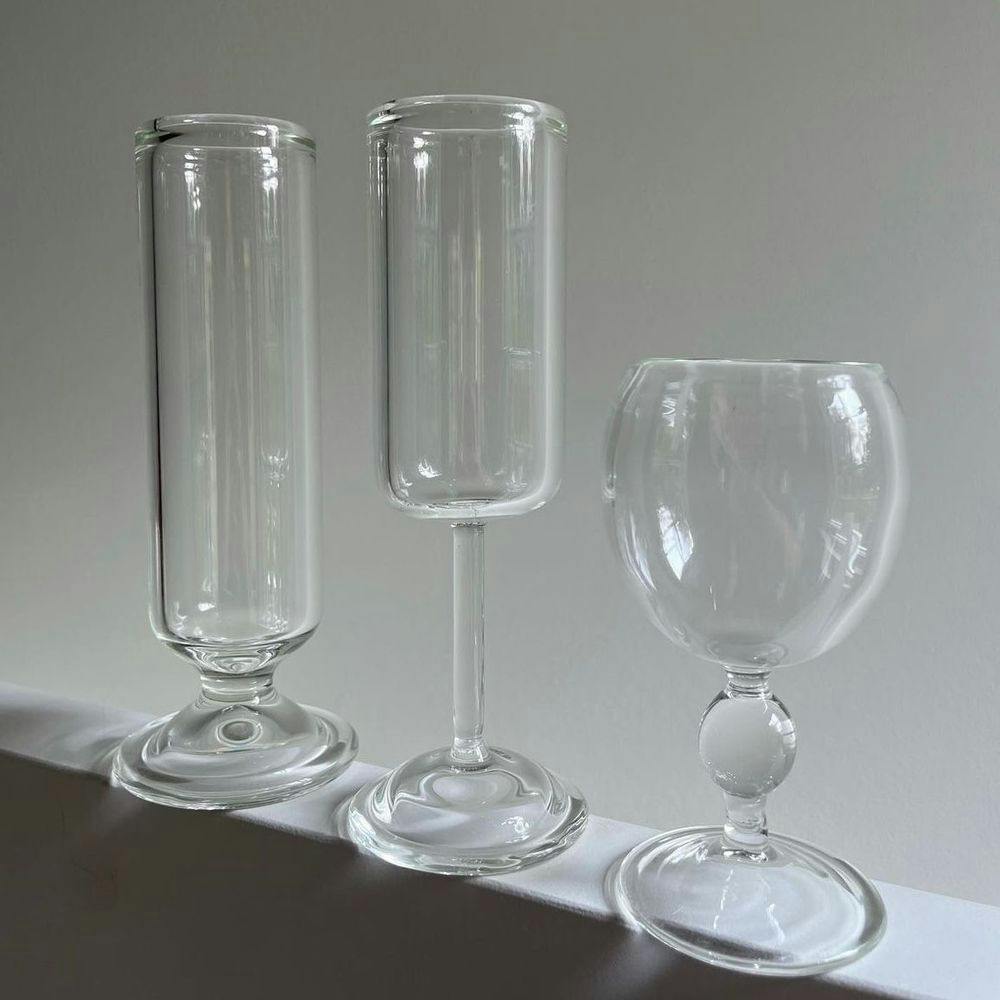 Three glasses on a shelf