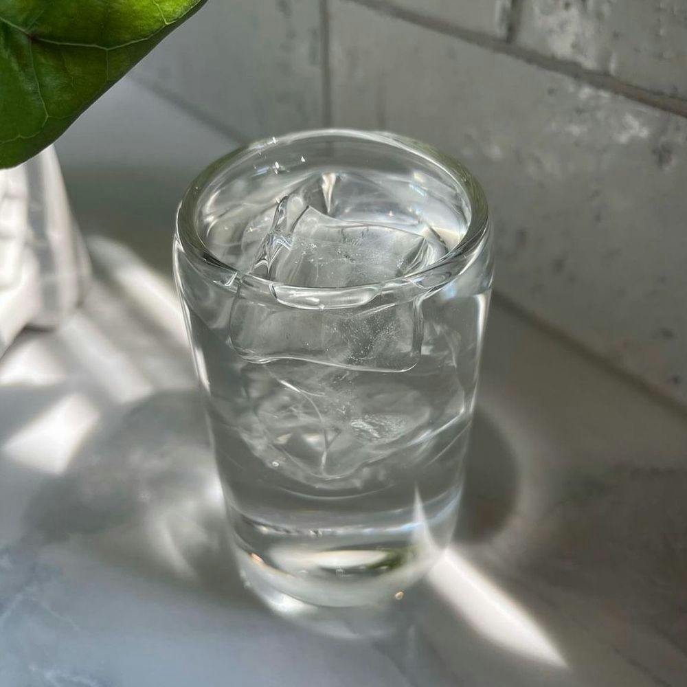 clear glass cup with water